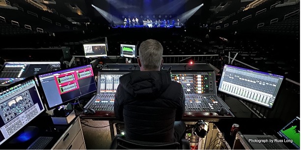 man with an audio mixer