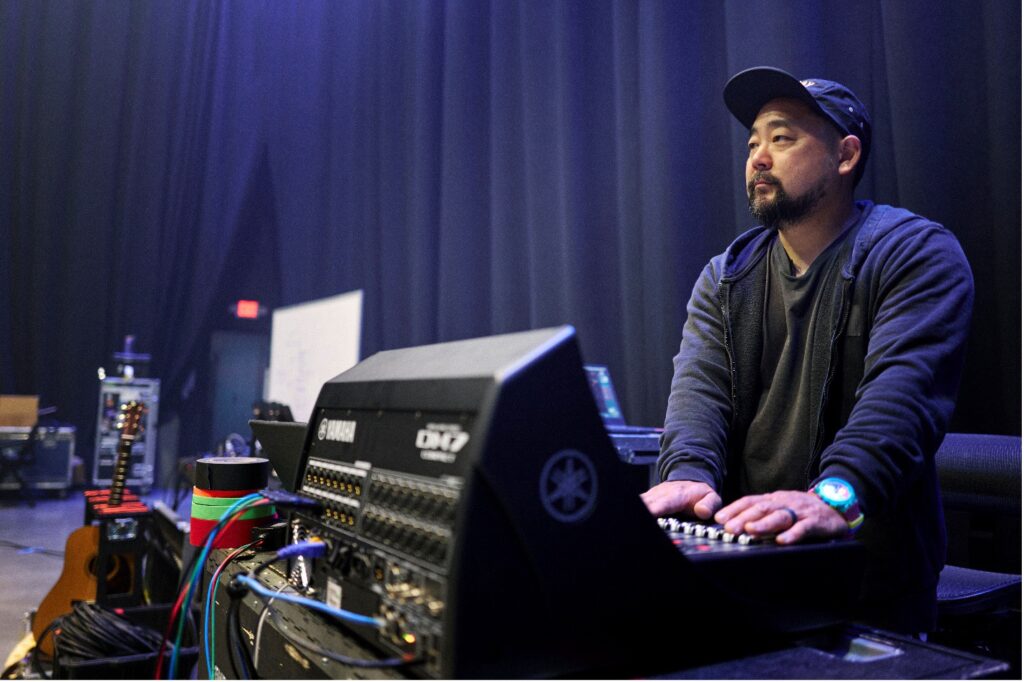 man using an audio mixer