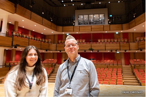 woman and man on stage
