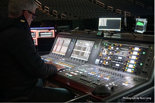 man with an audio mixer