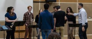 Dr. Aaron Witek with a group of trumpet students