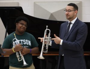 Dr. Aaron Witek with a trumpet student