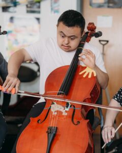 Crescendo Orchestra student playing the cello
