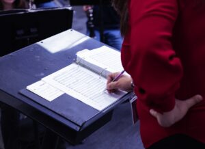 music teacher making music on podium