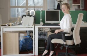 school secretary sitting at desk 