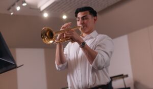 student playing the trumpet