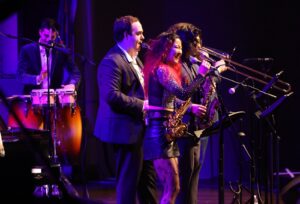 jazz performance with three saxophonists, a trombone player and a percussionist