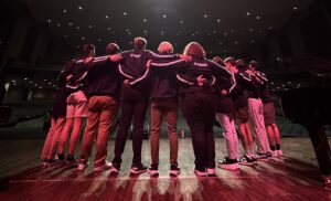 group huddle with small group of musicians