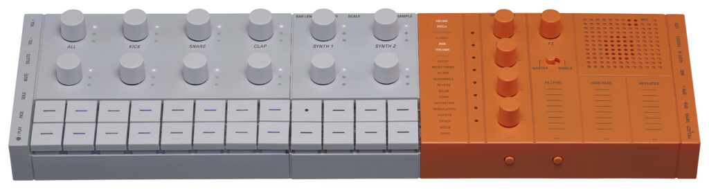 A compact gray and orange music creation station with various knobs and switches.