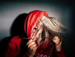 angry student wearing red hoodie