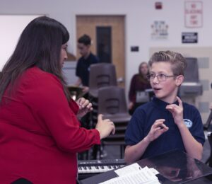 music teacher interacting with student