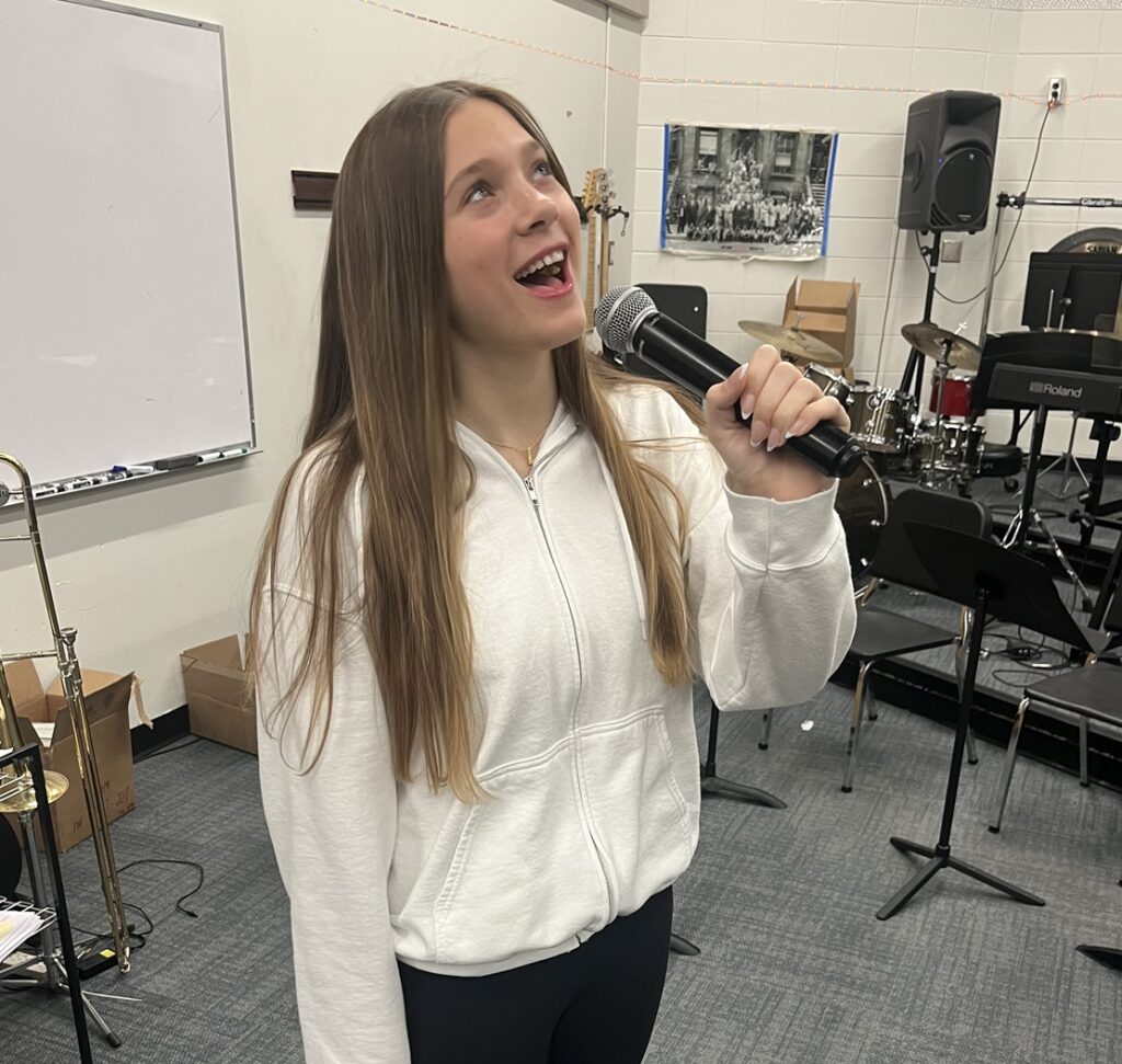 female singing with microphone