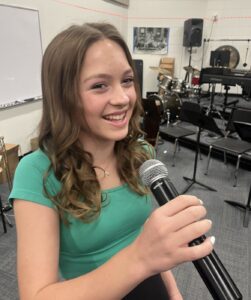 female singing with microphone