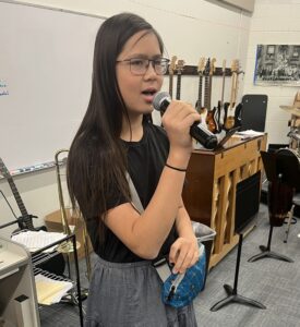 female singing with microphone