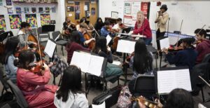 Hip-hop artist Christylez Bacon teaches Annandale High School orchestra students in Annandale, VA