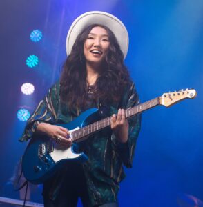 woman playing Yamaha Pacific on stage