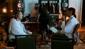 two women sitting and talking