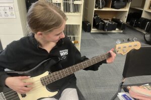 student playing bass guitar