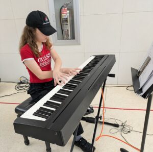 student playing keyboards