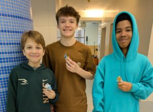 three happy students