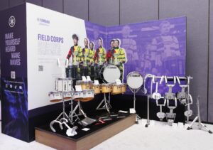 An area at a trade show showing marching drums.