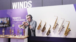 An area at a trade show showing wind instruments.