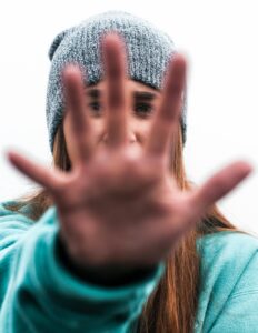 person holding hand out in front of her