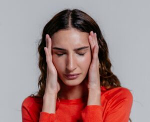 woman with hands on both sides of her face