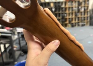 silly putty on the side of a guitar's neck