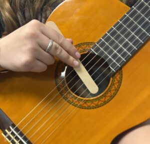 using tongue depressor on guitar strings