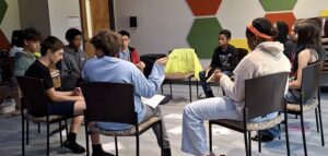 circle of 8th graders during music class