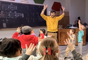 teacher finger tapping with kindergarten students 