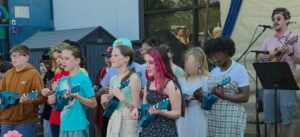 students playing ukuleles during May Day performance