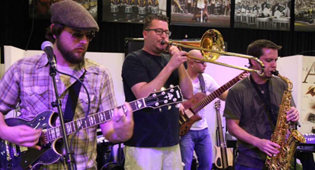 small band playing in front of class