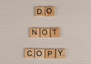 letter tiles that spell out "do not copy"