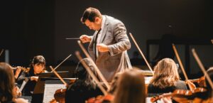 music teacher conducting during performance