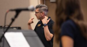 music teacher at front of class