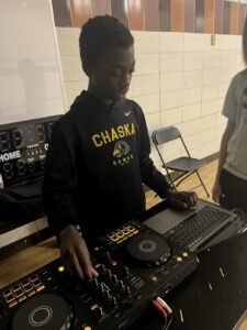 student working on music production equipment