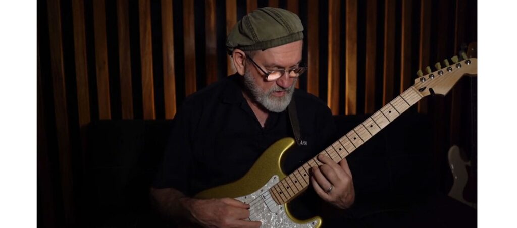 man playing the neo soul guitar