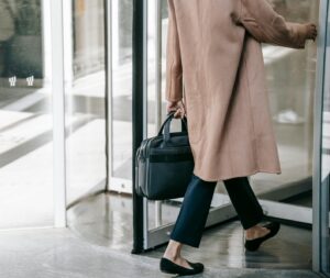 woman walking through a revolving door