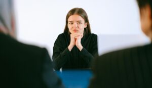 woman looking uncomfortable during a meeting