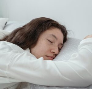adult woman sleeping in bed 