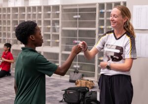 music teacher and student fist-bumping 