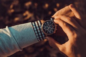 someone looking at his wristwatch