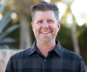 A smiling man.