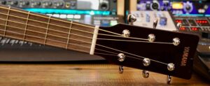The headstock of a Yamaha acoustic guitar.