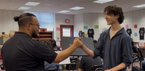 orchestra director and student interacting