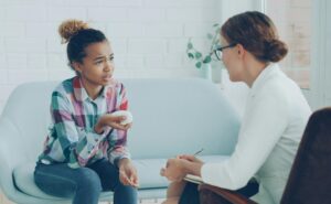 student talking to a counselor