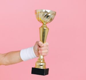 hand holding a trophy