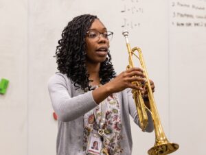 music educator showing proper way to hold trumpet